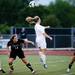 Huron players watch as Skyline senior Mackenzie Stites heads the ball during the game on Thursday, May 30. Daniel Brenner I AnnArbor.com